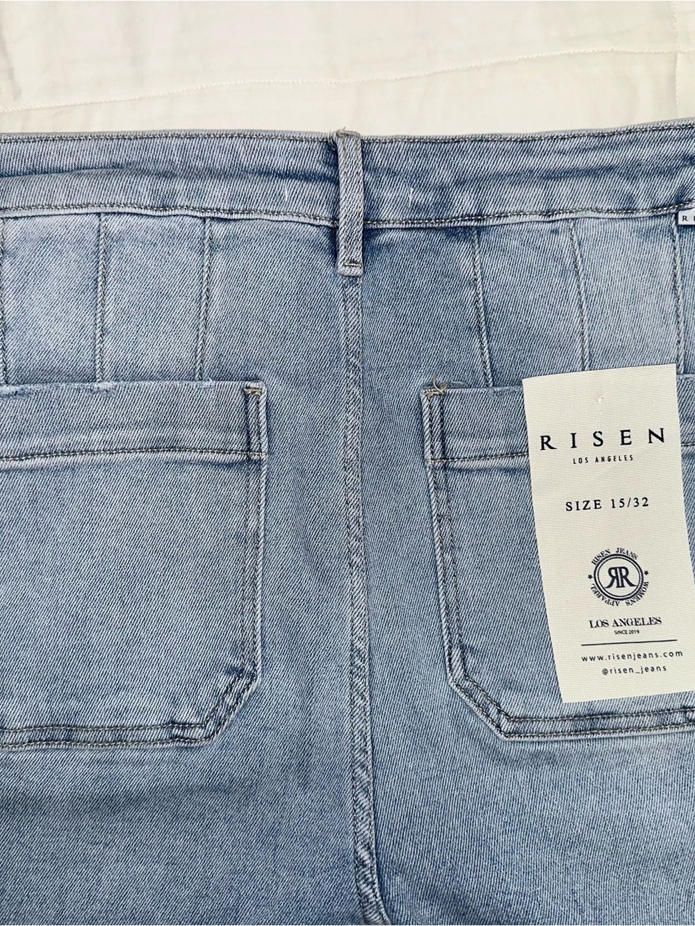 Risen High Rise Wide Leg Slanted Pocket Jeans